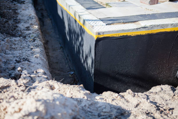 Professional Basement Waterproofing technician working in Randallstown, MD